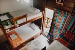 Postel nebo postele na pokoji v ubytování Esperanto Bed & Breakfast Surf Hostel