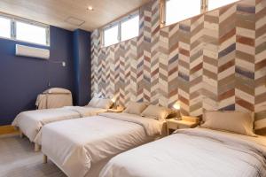 Ένα ή περισσότερα κρεβάτια σε δωμάτιο στο Morihiro-biuilding 守弘ビル #MIYx