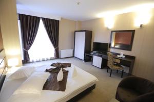 Postel nebo postele na pokoji v ubytování Hotel Meliss