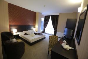 Postel nebo postele na pokoji v ubytování Hotel Meliss