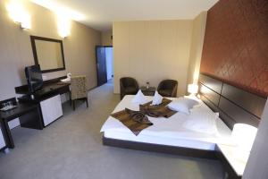 Postel nebo postele na pokoji v ubytování Hotel Meliss