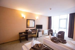 TV a/nebo společenská místnost v ubytování Hotel Meliss