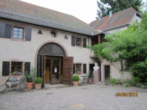 a large white building with a large doorway at Tilly's B&B and apartment house in Le Hohwald