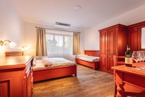 Postel nebo postele na pokoji v ubytování KNÍŽECÍ DŮM - ubytování v Lednici