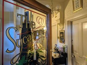 a store window with the words the entrance on it at The Sycamore Guest House in York