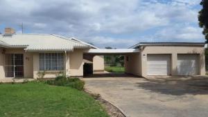 a house with a garage and a driveway at A Touch of Eden in Fort Beaufort