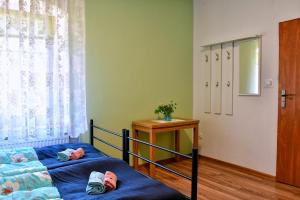En eller flere senge i et værelse på Zielony Dom na Wzgórzu