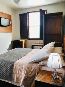 Posteľ alebo postele v izbe v ubytovaní Pousada do Chafariz