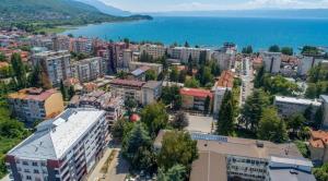 an aerial view of a city with buildings and the ocean at Apartments Kanevce City Center in Ohrid
