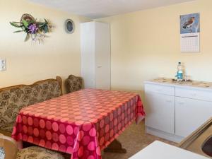 a small room with a table and a counter at Scintillating Apartment in Wienrode near City Centre in Wienrode