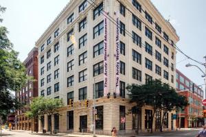 a large white building on a city street at Abode Pittsburgh - Downtown Convention Center in Pittsburgh