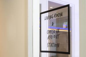 a window with a sign on it with writing on it at Hotel 171 in Rotterdam
