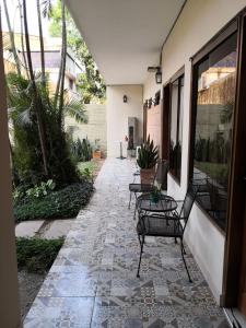 Сад в De la Mora Hostal