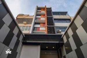 a tall building with a colorful facade at Tamansari Agung Residence in Jakarta