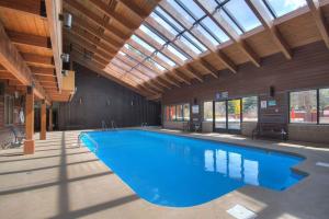 a large swimming pool in a building with a ceiling at 201C Mountain Side 1BR 1BA condo in Frisco