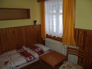Postel nebo postele na pokoji v ubytování Lesní Bouda