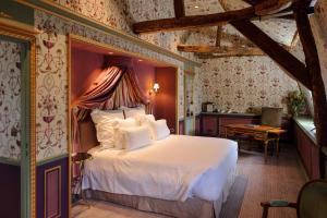 Un ou plusieurs lits dans un hébergement de l'établissement Château de Courcelles - Relais & Châteaux