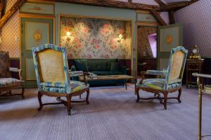 Coin salon dans l'établissement Château de Courcelles - Relais & Châteaux