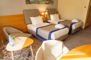 Cama ou camas em um quarto em Holiday Inn - Aktau - Seaside by IHG