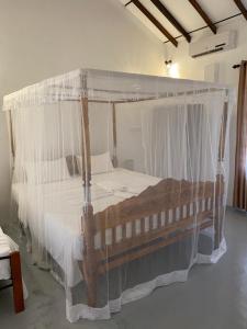 Postel nebo postele na pokoji v ubytování Kanada House Unawatuna