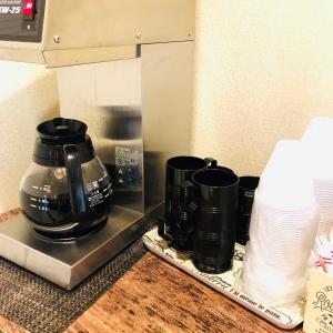 a coffee pot and cups sitting on a counter at Hotel Chuo Crown in Osaka