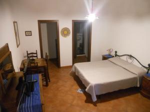 A bed or beds in a room at Pedra Residence