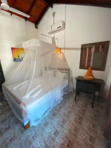 Postel nebo postele na pokoji v ubytování Kanada House Unawatuna