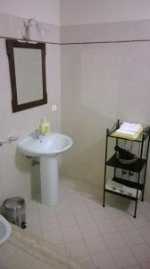 a bathroom with a white sink and a mirror at B&B La Giostra di Foligno in Foligno +7 photos