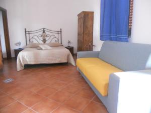 A bed or beds in a room at Pedra Residence