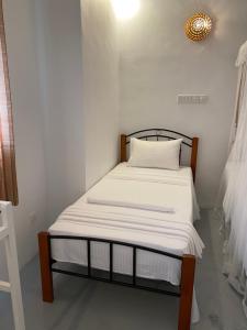 Postel nebo postele na pokoji v ubytování Kanada House Unawatuna