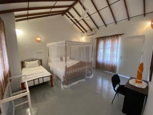 Postel nebo postele na pokoji v ubytování Kanada House Unawatuna