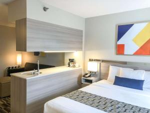 Ένα ή περισσότερα κρεβάτια σε δωμάτιο στο Microtel Inn & Suites by Wyndham Eagan/St Paul