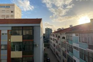 a view of a city street with buildings at Barreiro Central Apartment in Barreiro