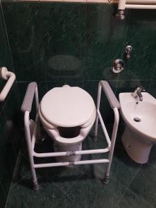 a bathroom with a toilet and a sink at Hotel Mirage in Rome