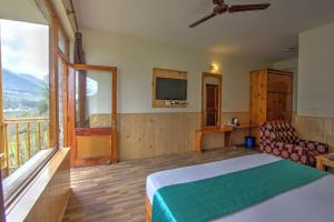Rúm í herbergi á Hotel Mountain face by Snow City Hotels