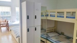 Postel nebo postele na pokoji v ubytování Bella Guesthouse