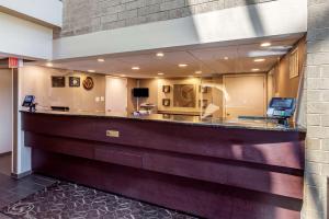 a lobby with a reception desk in a building at Comfort Suites Oakbrook Terrace near Oakbrook Center in Oakbrook Terrace