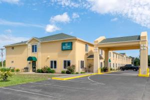 a hotel with a parking lot in front of it at Quality Inn & Suites in Brandenburg