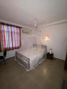 Postel nebo postele na pokoji v ubytování Kanada House Unawatuna