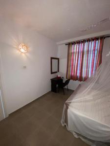 Postel nebo postele na pokoji v ubytování Kanada House Unawatuna