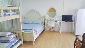 Postel nebo postele na pokoji v ubytování Bella Guesthouse