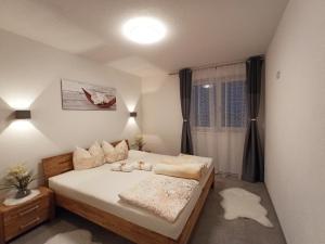 Postel nebo postele na pokoji v ubytování The AlpenHouse Gligic´s