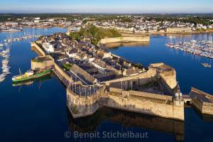 an aerial view of a castle in a harbor at FLOREVA 43 Proche plage et thalasso in Concarneau