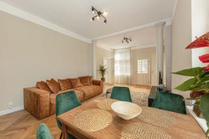 a living room with a couch and a table at Tõnisson Apartments in Tartu