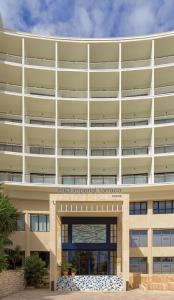 an exterior view of a building with the hico medical leases sign at H10 Imperial Tarraco 4 Sup in Tarragona