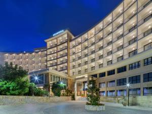 a rendering of a hotel at night at H10 Imperial Tarraco 4 Sup in Tarragona