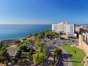 an aerial view of a city and the ocean at H10 Imperial Tarraco 4 Sup in Tarragona