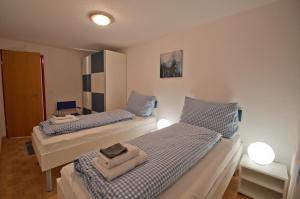 Кровать или кровати в номере Haus Bahnhofbuffet, Apartment Riffelhorn