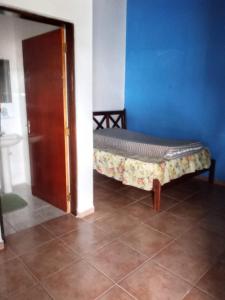 Ένα ή περισσότερα κρεβάτια σε δωμάτιο στο Casa Morada da Praia
