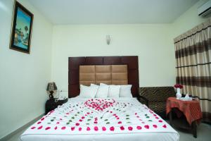 Llit o llits en una habitació de Hotel Mishuk
